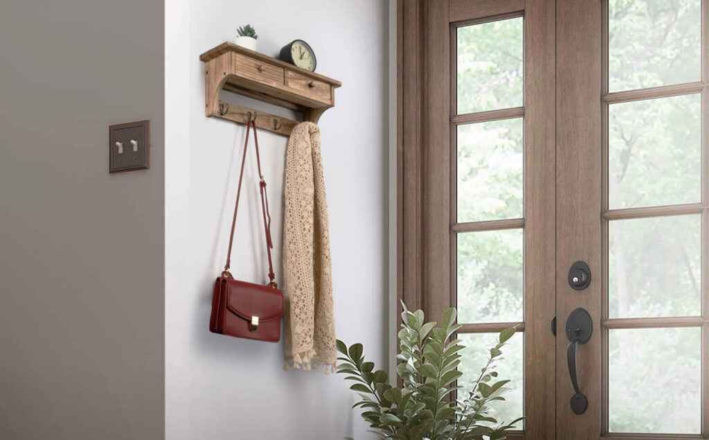 Emfogo floating shelf with hooks in an entryway