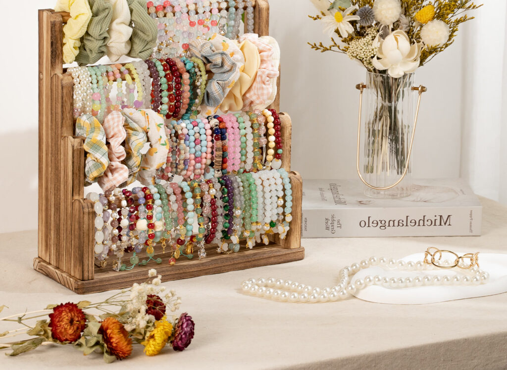 Wooden Emfogo bracelet and scrunchie organizer on a vanity